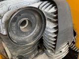 a close up of a small engine on the back of a truck