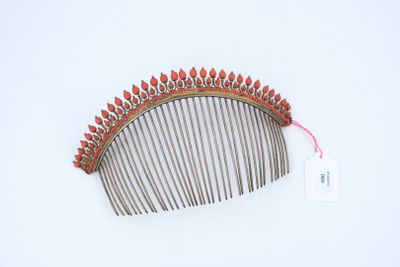 an image of a hair comb on a white surface