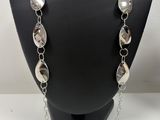 a close up of a necklace on a mannequin mannequin