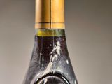 a bottle of wine that is sitting on a table