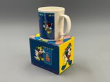 two mugs are stacked on top of each other on a box