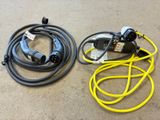 an image of a couple of yellow and black hoses on a floor