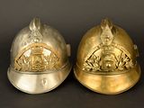 two helmets that are sitting next to each other on a table