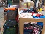 a carton full of clothes and other items in a warehouse