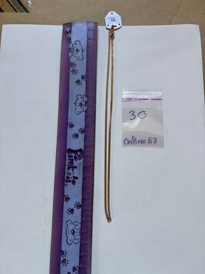 a picture of a book with a purple ribbon and a tag on it