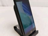 a cell phone that is sitting on top of a stand