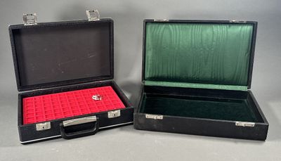 two open briefcases sitting side by side on a table