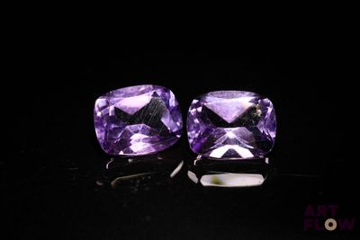 pair of purple amethorate earrings on black background