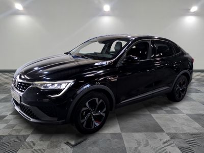 a black suv parked on a checkered floor in a garage