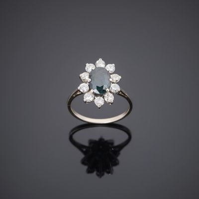 an aquamarinee and diamond cluster ring