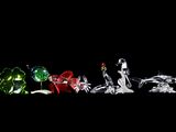 four different colored glass figurines on a black background