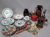 many different types of plates and vases on the table