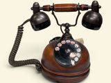 an old fashioned telephone that is sitting on a table
