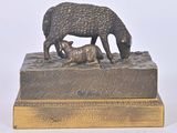 a bronze statue of a sheep and a baby sheep