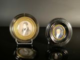 two plates with a picture of a man and a woman on them