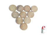 a lot of coins arranged in the shape of a heart