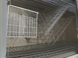 an image of a metal staircase going up to a building