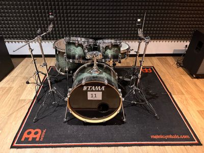 the drum kit is ready to be used in the recording room
