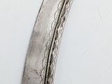 a knife that is laying on top of a table