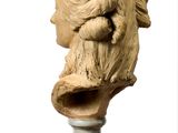 a statue of a man with a beard on a table