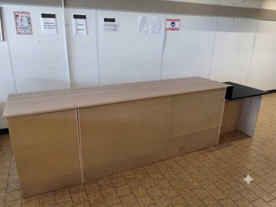 an image of a reception desk in a large room