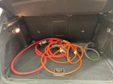 a trunk of a car with a bunch of hoses in it