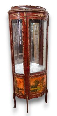 a display cabinet with a glass door in the middle