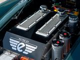 a close up of the engine of a green sports car