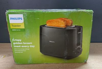 philips toaster box with two pieces of toast on top of it