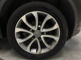 a close up of a car ' s tire on the street