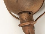 an old brass bell hanging on the wall