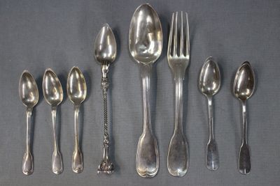 five spoons and six forks arranged in a row