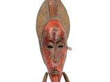 an image of a wooden mask on a white background