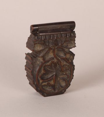 a small vase with a decorative design on it
