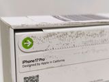 a white box with a green sticker on it