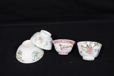 three small cups and saucers are sitting on a black surface