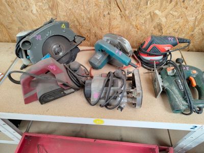 many different tools on a shelf in a room