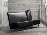 a black couch that is sitting in a room