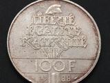 a close up of a coin on a black surface