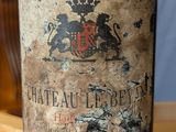 a bottle of wine that is sitting on a table