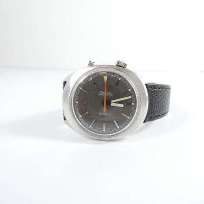 a watch that is sitting on a white surface
