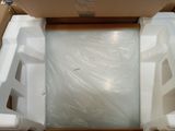 a box that has a toilet inside of it