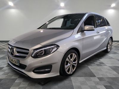 the mercedes b - class is parked on a checkered floor