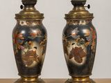 pair of antique japanese vases on stand on wooden surface