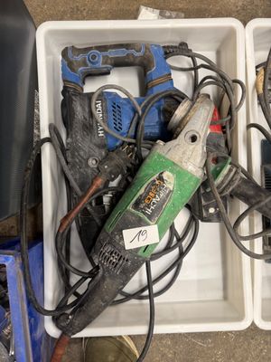 two boxes with tools in them sitting on the floor