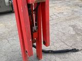 a fork that is attached to a pole in a parking lot