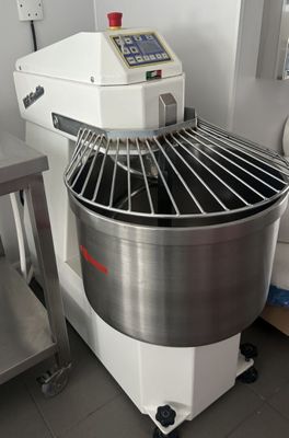 an image of a large industrial mixer in a kitchen