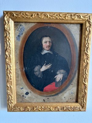 portrait of a man in a black coat and red pants in a gold frame