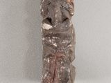 a stone statue of a man with a hat on his head