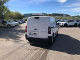 a white van that is parked in a parking lot